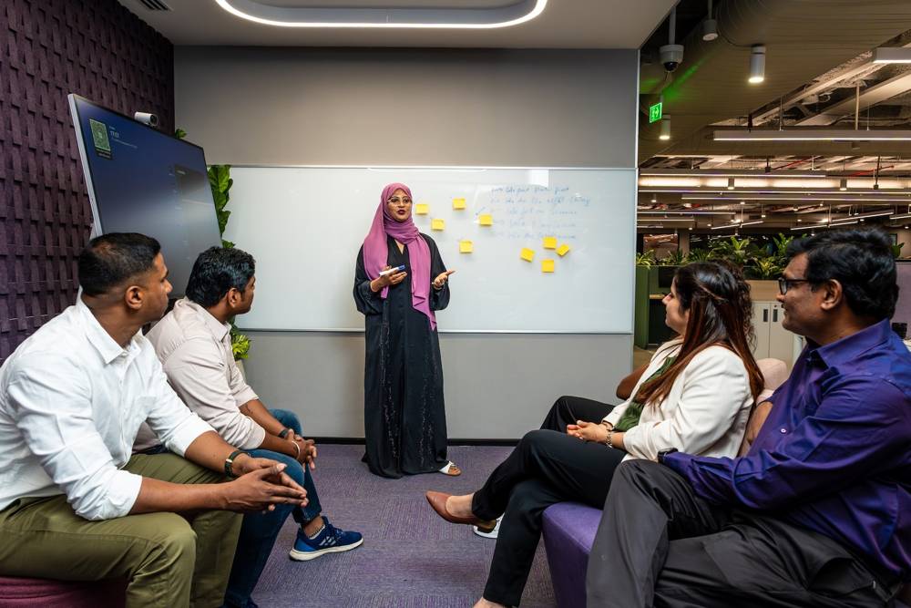 Colleague presenting ideas to a team in a workshop